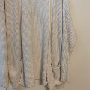 Oversized white knit cardigan with pockets